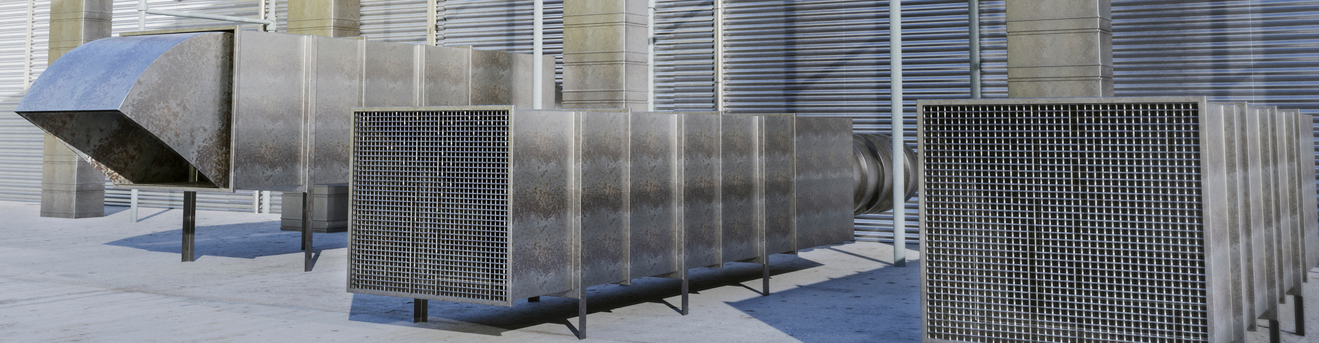Metal ductwork and vent grilles outside a commercial building