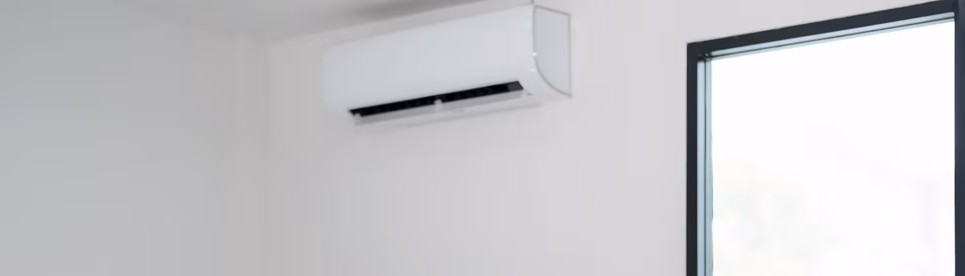 Wall-mounted split air conditioner unit near ceiling, relevant to ac not working issues